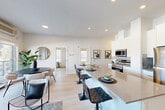 Located at 11830 SW 26 Ave in Edmonton, Alberta, this well-appointed 2-bedroom, 2-bathroom unit offers a thoughtfully designed single-level layout that maximizes functionality and comfort. The open-concept kitchen and living area serves as the heart of the home, featuring a sleek, modern kitchen with white cabinetry, stainless steel appliances, a central island with bar seating, and light hardwood flooring that flows throughout the space. Large windows in the living area flood the room with natural light and provide views of the surrounding neighbourhood, while a sliding door opens onto a private balcony.

The balcony extends the living space outdoors, offering views of the landscaped community and surrounding area. The primary bedroom is a comfortable retreat with a generous window and neutral tones. The second bedroom also benefits from natural light and built-in closet storage. A dedicated office provides a quiet, windowed workspace. Both bathrooms are finished with clean, modern tilework, with one featuring a glass-enclosed walk-in shower. Light hardwood flooring, recessed lighting, and a consistent neutral palette lend the entire unit a cohesive, contemporary ambiance.