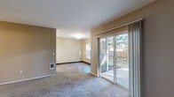 Located at 1012 Hidden Creek Dr NE in Keizer, Oregon, this two-bedroom, two-bathroom single-floor home offers a well-organized layout designed for comfortable everyday living. The living area is finished with plush carpeting and features sliding glass doors that open to a private outdoor patio, allowing natural light to fill the space and providing easy access to the fenced backyard. Warm, neutral-toned walls carry throughout the home, creating a cohesive and inviting atmosphere.

The galley-style kitchen is equipped with white cabinetry, ample counter space, a double-basin sink, and white appliances including a range and refrigerator. Wood-look flooring runs the length of the kitchen, adding a practical and clean aesthetic. A window at the end of the kitchen brings in additional natural light.

Both bedrooms are carpeted and feature neutral walls, providing a calm and restful environment. The primary bedroom offers a comfortable amount of space, while the second bedroom includes a sliding closet and a window with outdoor views. Each bathroom is functional and clean — one features a walk-in shower with a glass door and chrome fixtures, while the other includes a vanity with a single sink, wood-look flooring, and clean white finishes throughout.