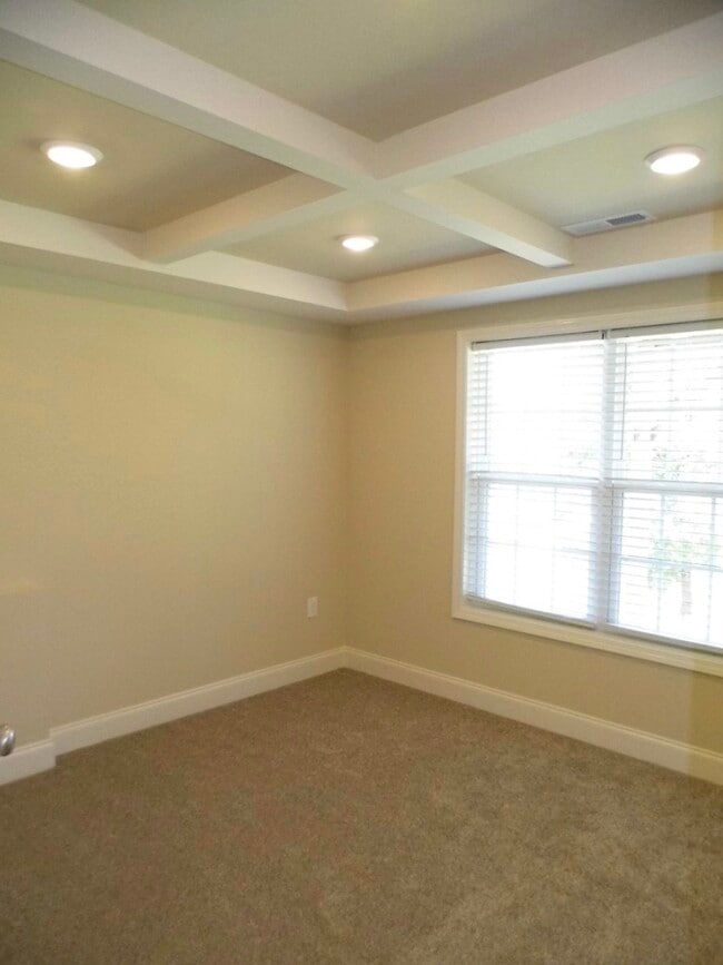 The Master bedroom coffered ceiling, large double window overlooking back yard - 2312-A Belle Ave NE