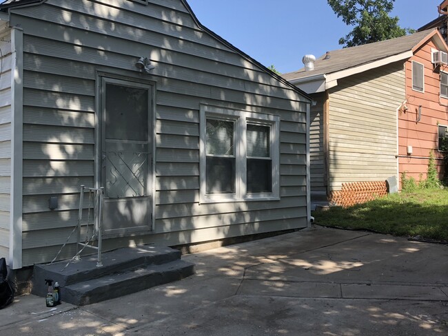 Back patio with newly refinished shed - 4615 Bell St