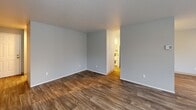 Located at 775 Cascade St in Oregon City, Oregon, this one-bedroom, one-bathroom unit is thoughtfully laid out across a single floor, offering a functional and comfortable living space. The combined dining and living room serves as the heart of the unit, featuring wood-style laminate flooring, a tile-surround fireplace, and multiple windows with horizontal blinds that invite natural light and outdoor views. A dedicated entrance and hallway lead seamlessly through the space.

The galley-style kitchen is well-appointed with white cabinetry, granite-look countertops, a full suite of white appliances, and a ceiling fan with access to the balcony through sliding glass doors. An in-unit laundry area is conveniently accessible directly from the kitchen, housing a full-size washer and dryer with overhead shelving.

The bedroom is generously sized, finished with plush carpet, a mirrored sliding-door closet, a window with natural light, and a baseboard heater. An additional closet provides extra storage. The bathroom features wood-style flooring, a tub/shower combo, a white vanity with granite-look countertop, and brushed nickel fixtures throughout. Two closets round out the storage options in this well-organized home.