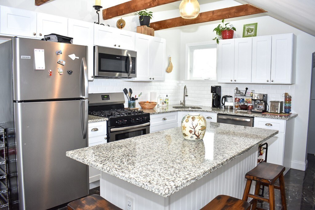 New kitchen! White shaker cabinets, new appliances, island seating, exposed beams! - 55 Cliff Ave