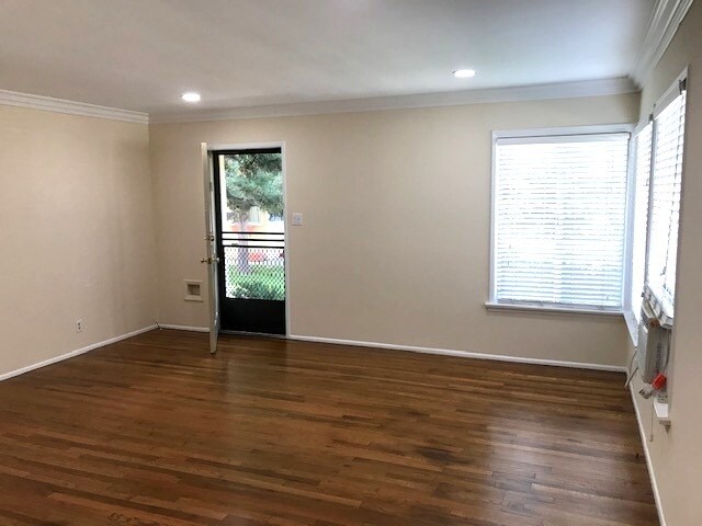 Living rm. w/ new recessed lighting, hardwood flooring & AC - 561 N Rosemary Ln