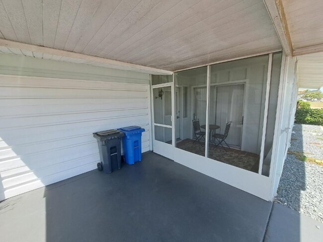 Morning coffee in screened in porch. - 1531 Council Dr