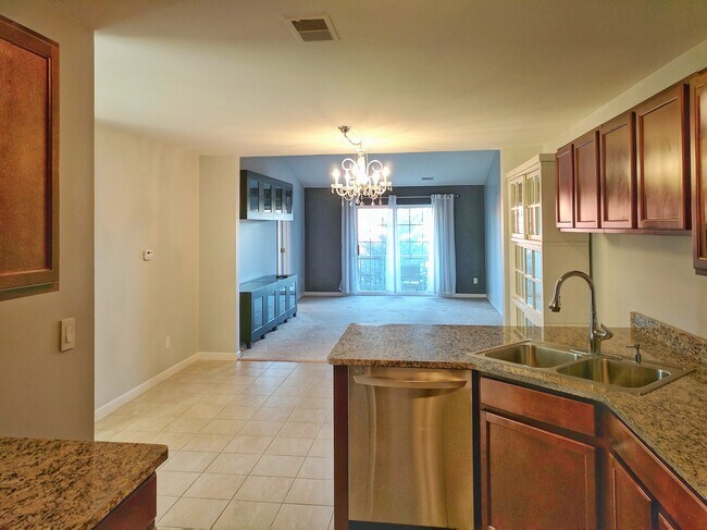Kitchen looking into dining area and living room - 305 Victoria Dr