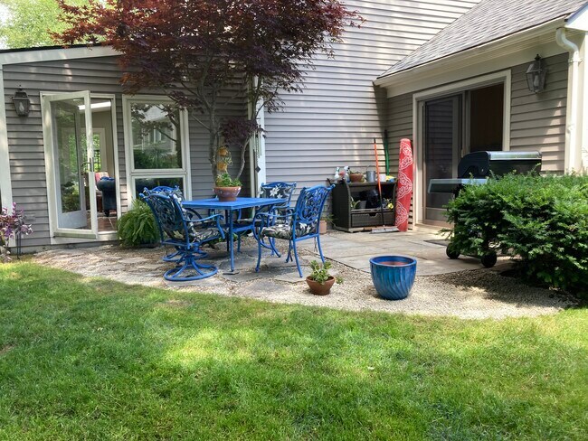 Backyard patio accessible through master bedroom and sunroom - 42 Foreside Cmn