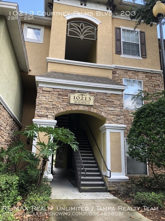 Building Photo - 10213 Courtney Palms BLvd #203
