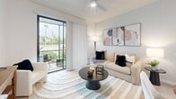 Located at 7430 Lyons Rd in Wellington, FL, this well-appointed one-bedroom, one-bathroom residence offers a thoughtfully designed single-floor layout. The open-concept living area seamlessly connects the kitchen, dining, and living spaces, creating an airy and cohesive environment. Light-toned luxury vinyl plank flooring flows throughout, complemented by a neutral color palette that enhances the sense of brightness.

The modern kitchen is a standout feature, boasting sleek white flat-panel cabinetry extending to the ceiling, white quartz countertops, a central island with bar seating, stylish pendant lighting, and a full suite of stainless steel appliances including a French door refrigerator and stainless range. The living room is bathed in natural light from large sliding glass doors that open to a private patio, offering pleasant outdoor views of lush landscaping.

The spacious primary bedroom features a ceiling fan, natural light from a large window, and ample closet space. The bathroom is clean and modern, featuring large-format white tile flooring, a floating wood-toned vanity with quartz countertop, and a soaking tub with shower. Additional conveniences include in-unit laundry and multiple closets throughout.