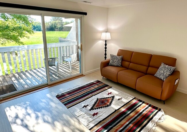 Leather reclining sofa, USB/C outlets in armrests. Center back folds fwd w cup holders/charger. - 174 Hemingway Ct