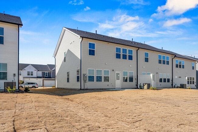 Building Photo - BRAND-NEW TOWNHOME-PRICE REDUCED!  Close t...