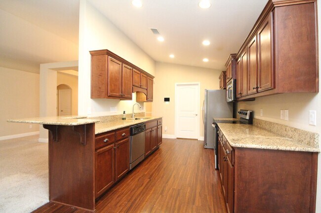 Building Photo - Modern Living in Logan Place – Split Floor...