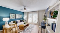 Located at 305 Brookfield Dr in Myrtle Beach, SC, this thoughtfully designed 2-bedroom, 2-bathroom single-story home offers a comfortable and functional layout. The living room serves as the heart of the home, highlighted by a bold teal accent wall, light hardwood-style flooring, a ceiling fan, and French doors that invite natural light and outdoor access. The galley-style kitchen is finished with white shaker cabinetry, white quartz countertops, subway tile backsplash, stainless steel appliances, and light wood flooring that flows seamlessly into the adjacent dining area. The primary bedroom is a serene retreat featuring plush carpet, a ceiling fan, a soft sage green accent wall, and a window with natural light. The second bedroom carries a complementary coastal aesthetic with carpet flooring and ample natural light. Both bathrooms are clean and functional, featuring white vanities with quartz countertops and tub-shower combinations. A dedicated laundry room houses a full-size washer and dryer with additional shelving for storage. Two closets provide practical organization throughout the home. The overall ambiance is bright, cohesive, and coastal-inspired, making this Myrtle Beach residence a well-rounded and inviting space.