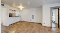 Located at 2800 Douglas Ave in Dallas, TX, this efficiently designed studio offers a smart, functional layout across a single floor. The open living area is bright and welcoming, featuring light wood-look tile flooring, recessed lighting, a ceiling fan, and a large window that invites natural light and outdoor views. The seamlessly connected kitchen is well-equipped with white cabinetry, dark granite countertops, a mosaic tile backsplash, stainless steel appliances including a refrigerator and range, and a deep basin sink — all illuminated by stylish track lighting overhead. A peninsula counter visually defines the kitchen from the living space while keeping the layout open and airy. The bathroom is thoughtfully appointed with a vessel sink set atop a white vanity with granite counters, framed mirror, contemporary light fixture, tile flooring, and a separate shower. Adding exceptional convenience, an in-unit washer is tucked neatly within the bathroom area. Clean white walls throughout create a neutral, versatile backdrop. This well-maintained space offers practical urban living in a prime Dallas location.