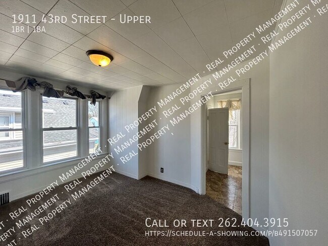 Building Photo - Upper 1 Bedroom w/ Den, Heat Included!