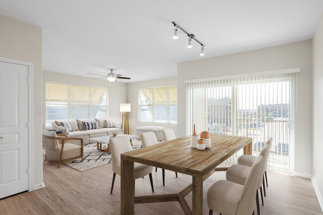 Dining and living room with hard surface vinyl plank flooring - Avalon at Pier 121