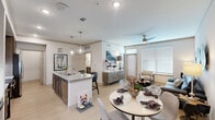 Located at 14919 TC Jester Blvd in Houston, TX, this well-appointed one-bedroom, one-bathroom residence offers a thoughtfully designed open-concept layout with modern finishes throughout. The combined kitchen and living area serves as the heart of the home, where light wood-style flooring, recessed lighting, and a ceiling fan create a bright and comfortable atmosphere. Large windows invite generous natural light into the living space, which is further enhanced by a spacious feel that extends seamlessly to the dining area. The kitchen is a standout, featuring rich dark wood cabinetry, stainless steel appliances, subway tile backsplash, globe pendant lighting, and a generous granite-topped island with bar seating — ideal for both cooking and entertaining. Built-in shelving adds a decorative and functional touch. The carpeted bedroom offers a tranquil retreat with large windows, ceiling fan, and direct access to both the bathroom and a dedicated closet. The bathroom is finished with granite countertops, tile flooring, and a full soaking tub with tiled surround. A dedicated laundry area with a full-size washer and dryer and overhead shelving rounds out this practical and stylish residence.