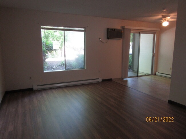 living room, wall AC, dining area, slider to patio - 1611 W 6th Ave