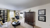 This well-designed 2-bedroom, 2-bathroom residence in Lexington, SC offers a practical and comfortable single-floor layout with a bonus sunroom. The main living area is spacious and carpeted, featuring neutral walls that create a bright, welcoming ambiance. An open passageway connects the living room to the sunroom, which is bathed in natural light from multiple windows — an ideal space for relaxing or entertaining. The kitchen is equipped with light wood cabinetry, dark granite-style countertops, black appliances including a refrigerator, range, and microwave, and tile flooring, offering both functionality and style. The primary bedroom is generously sized, featuring plush carpet, a ceiling fan, and ample closet space. The second bedroom provides similar comfort and flexibility. Both bathrooms are well-appointed, with one featuring tile flooring, a vanity with countertop storage, and a shower-tub combination. A hallway connects the bedrooms to the main living areas, enhancing the flow of the floor plan. Throughout the home, a cohesive neutral color palette provides a versatile backdrop, making this a move-in-ready residence suited for a variety of lifestyles.