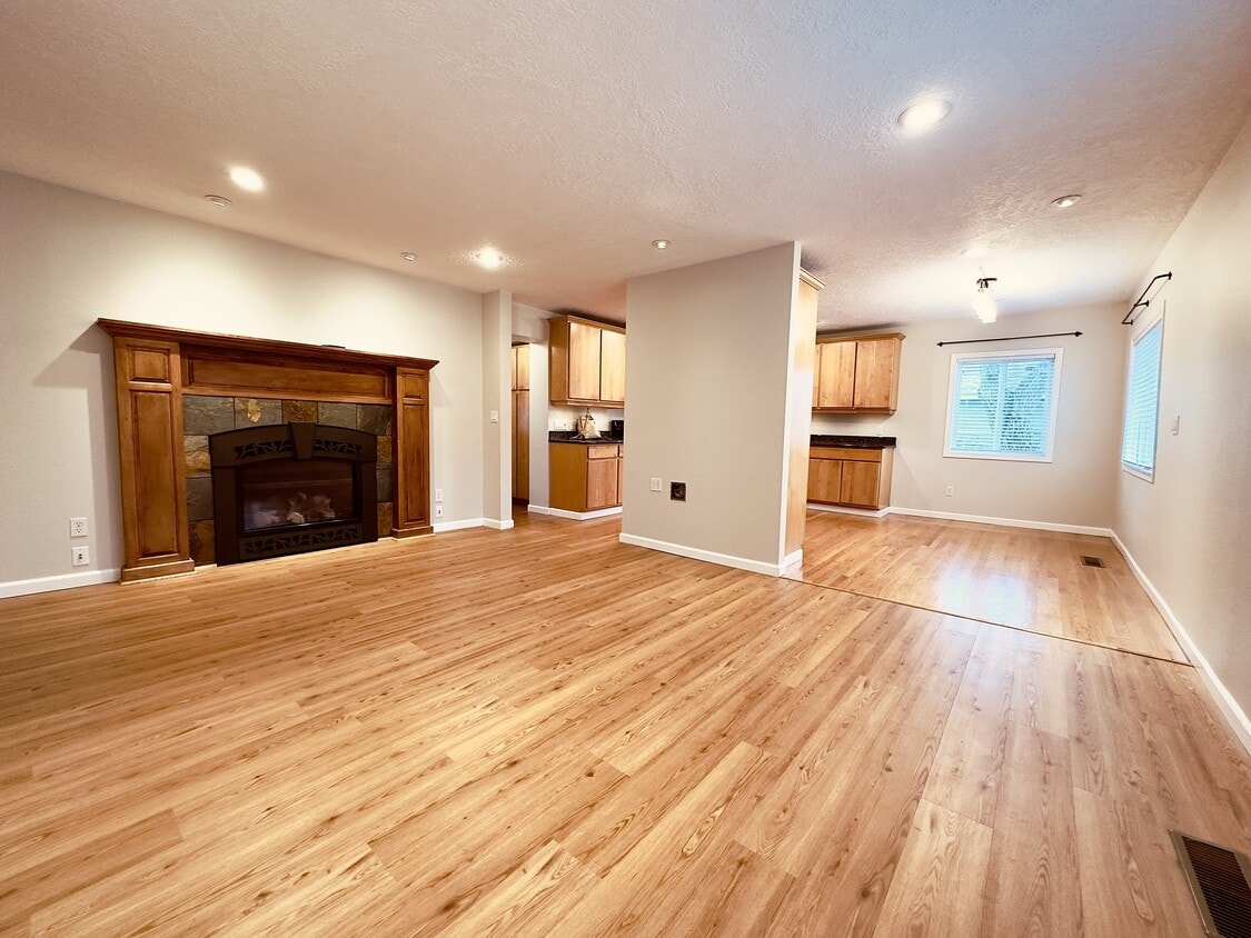 View of living room, dining room, and kitchen - 8717 NE Webster St