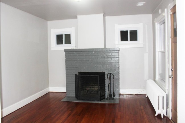 Living room, wood burning fireplace - 2603 12th St NE