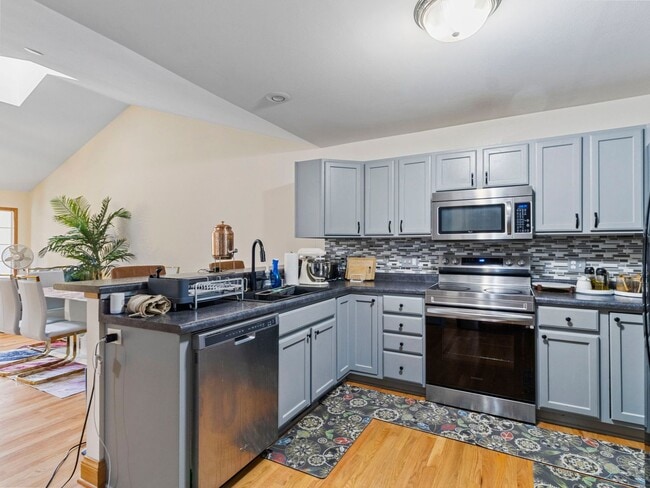 Building Photo - Spacious 3BR/3BA Condo with Finished Basement + 2-Car Garage — Available Now