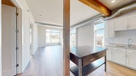 Located on North Commerce Street in Milwaukee, WI, this two-bedroom, two-bathroom residence blends modern finishes with industrial character across a single, well-designed floor. The open-concept kitchen and living area serves as the heart of the home, highlighted by exposed wooden beams, visible ductwork, and light hardwood flooring that together create a warm loft-inspired aesthetic. The kitchen is outfitted with white shaker cabinetry, granite countertops, stainless steel appliances, and a double sink—offering both style and functionality. Large windows throughout the living area flood the space with abundant natural light and frame views of the surrounding Milwaukee streetscape. The two bedrooms are carpeted for comfort, each featuring generous closet space with sliding doors and bright windows overlooking the neighborhood. With four closets total, storage is plentiful throughout the unit. The two bathrooms are finished with dark tile flooring and include a full tub-shower combination. A dedicated entrance and private balcony round out the layout, adding everyday convenience and an inviting outdoor retreat. Clean lines, neutral tones, and thoughtful details make this a bright and functional urban residence.