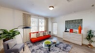 Located in Little Elm, TX, this thoughtfully designed one-bedroom, one-bathroom residence delivers a comfortable and efficient layout across a single floor. The open-concept living room and kitchen area forms the heart of the home, bathed in natural light through multiple large windows dressed with stylish patterned curtains and slatted blinds. Wood-style plank flooring flows throughout, lending warmth and visual continuity to the space.

The kitchen is a standout feature, boasting crisp white cabinetry extending to the ceiling, dark granite countertops, a tile backsplash, and a full suite of stainless steel appliances including a refrigerator, range, microwave, and dishwasher. A double-basin sink and pendant lighting complete the polished look. A dedicated laundry area is conveniently accessible from the kitchen.

The bedroom is a well-proportioned retreat featuring a ceiling fan, large windows with outdoor views, and direct access to a walk-in closet. The bathroom offers a clean, contemporary design with white cabinetry, a dark granite vanity, a tiled soaking tub and shower combination, and warm wood-tone flooring. Every room reflects a modern aesthetic with a neutral palette accented by bold, vibrant décor touches.