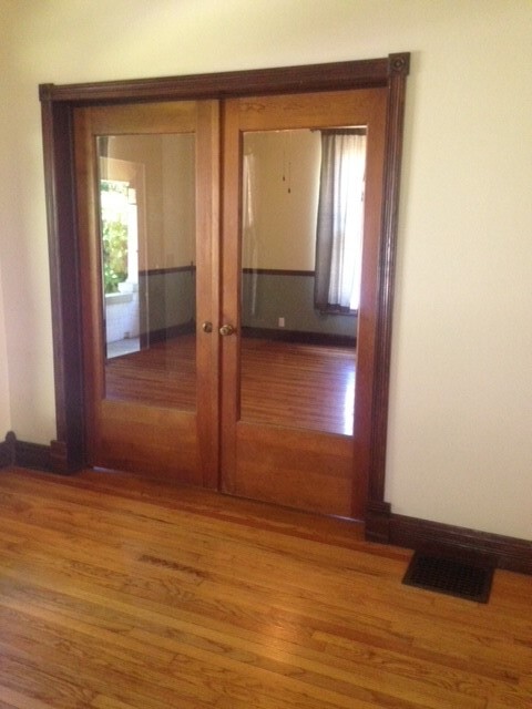 Standing in the living room, French doors entering into the North bedroom - 206 E Vermilya Ave