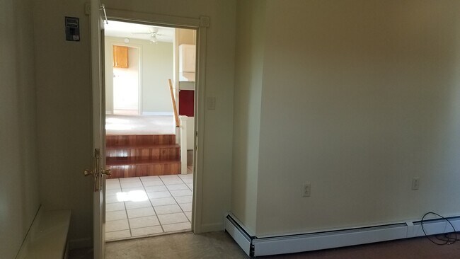 Looking from the bedroom, through the kitchen and living room to the bathroom. - 498 Bidwell Hill Rd