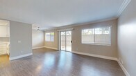 Located at 2262 Avenida Magnifica in Carlsbad, CA, this 2-bedroom, 2-bathroom single-floor residence offers a well-designed layout with modern finishes throughout. The open living area features wood-style hardwood flooring, crown molding, and a ceiling fan, bathed in natural light from multiple windows and a sliding glass door that opens to a private outdoor patio. The kitchen is equipped with stainless steel appliances, including a refrigerator, range, and microwave, complemented by white cabinetry, a tile backsplash, and a peninsula countertop with bar seating — ideal for casual dining or entertaining. Both bedrooms offer wood-style flooring, generous natural light from sizable windows with blinds, and mirrored sliding closet doors that add depth and functionality. The primary bedroom provides a comfortable, well-proportioned retreat. Both bathrooms are finished in a clean, contemporary style featuring white cabinetry with stone-topped vanities, tub-shower combinations, and wood-look tile flooring. Neutral warm-toned walls throughout create a cohesive and welcoming ambiance. Situated in the desirable coastal community of Carlsbad, this residence combines practical design with a relaxed Southern California aesthetic.