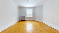 This 390 square foot apartment, located at 149 MacLaren St in Ottawa, offers a practical and efficient living space. The single-floor layout comprises an open-concept kitchen and living area, one bathroom, and an entrance. The kitchen is equipped with modern stainless steel appliances, including a refrigerator, dishwasher, and stove. White cabinetry and a subway tile backsplash contribute to a clean, contemporary aesthetic.

Throughout the apartment, gleaming hardwood floors add warmth and character. Large windows in the living area and bedroom provide ample natural light, enhancing the sense of spaciousness. The bathroom features a full-sized bathtub with shower, a toilet, and a single vanity, all finished in crisp white.

The living area is versatile, allowing for various furniture arrangements. A radiator heating system ensures comfort during colder months. Crown molding and baseboards add a touch of elegance to the otherwise modern design. Despite its compact size, the apartment's thoughtful layout maximizes functionality, making it an ideal urban dwelling for those seeking efficiency without sacrificing style.