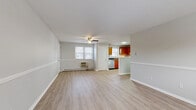 Located at 169 School St in Hamden, Connecticut, this one-bedroom, one-bathroom residence offers a practical and well-organized single-floor layout. The combined living and dining area forms the heart of the home, featuring light wood-look vinyl flooring, neutral gray walls with a distinctive chair-rail detail, a ceiling fan with light fixture, and windows that invite natural light. A wall-mounted AC unit and baseboard heating ensure year-round comfort.

The kitchen is efficiently designed with warm honey-toned wood cabinetry, dark countertops, a stainless steel refrigerator, electric range, and dishwasher, along with a window above the sink for added brightness. A hallway connects the main living areas to the bedroom and bathroom.

The spacious bedroom is finished with plush carpet flooring, soft neutral walls, and a window with a view to the outdoors, complemented by baseboard heating. Three closets throughout the unit provide generous storage.

The bathroom features a full tub and shower combination with classic tiled surround. A dedicated utility room rounds out the layout. With its clean finishes, functional design, and convenient Hamden location, this residence offers a comfortable and efficient living environment.