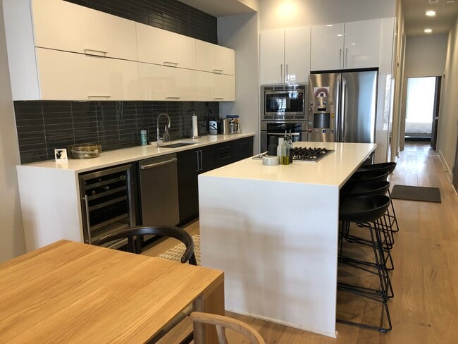 Kitchen w/ quartz counters and Bosch appliances - 1339 Irving Street NW Apt C