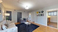Located at 1504 18th Ave S in Nashville's vibrant 12 South neighborhood, this single-story 1-bedroom, 1-bathroom home offers a well-organized layout across a compact but thoughtfully designed floor plan. Warm hardwood floors flow throughout the living spaces, lending a cohesive and inviting character to the home.

The living room serves as a welcoming central gathering space, featuring soft gray walls, a ceiling light fixture, and multiple doors providing access to other areas of the home. The dedicated dining room offers natural light through a window with blinds and a stylish overhead chandelier, making it a functional space for everyday meals. The kitchen features granite countertops, wood cabinetry, subway tile backsplash, and a window that allows natural light to brighten the workspace.

The bedroom is well-appointed with dual windows dressed in gray curtains, a ceiling fan with light, and two closets accessed through dark-painted six-panel doors. Additional closets throughout the home provide generous storage options. The bathroom showcases classic charm with penny-tile flooring, beadboard wainscoting, a pedestal sink, a full bathtub with shower, and a bright window — all finished in crisp white.

With four closets and hallway connections, this home maximizes its efficient layout while maintaining a comfortable, characterful living environment in the heart of Nashville.