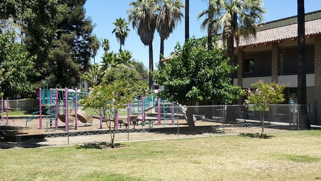 Fenced playground for daycare. - Filipino Plaza