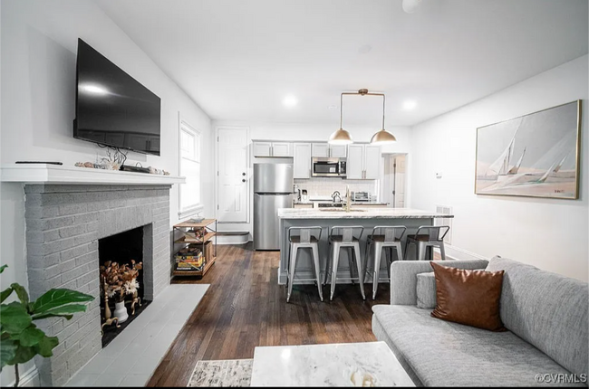 Open concept living and kitchen area. - 309 E Brookland Park Blvd