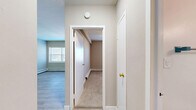 Located on North Prospect Avenue in Milwaukee's vibrant East Side neighborhood, this one-bedroom, one-bathroom unit offers a thoughtfully arranged single-floor layout that maximizes every square foot. The kitchen is a standout feature, outfitted with crisp white shaker cabinets, marble-look countertops, light hardwood-style flooring, and a full suite of stainless steel appliances including a range, over-the-range microwave, dishwasher, and refrigerator — delivering a modern, functional cooking space. Adjacent areas transition seamlessly, maintaining the light, neutral palette found throughout the unit. The bedroom offers a comfortable, carpeted retreat with soft taupe walls, a ceiling fan with light fixture, a natural window that invites in daylight, a dedicated closet with shelving, and baseboard heating. The bathroom features classic square ceramic tile in a soft sage green surrounding a full soaking tub with shower combo, complemented by a clean white vanity with brushed nickel fixtures and a mirrored medicine cabinet. Light wood-style flooring runs through the entry and kitchen areas, while plush carpet lines the bedroom. Neutral tones and clean finishes throughout give the space a move-in ready feel.