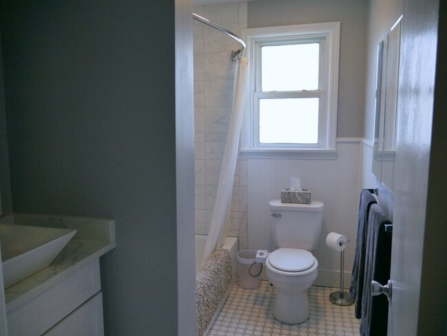 Main floor bathroom with rain shower head - 218 E Walton Ave