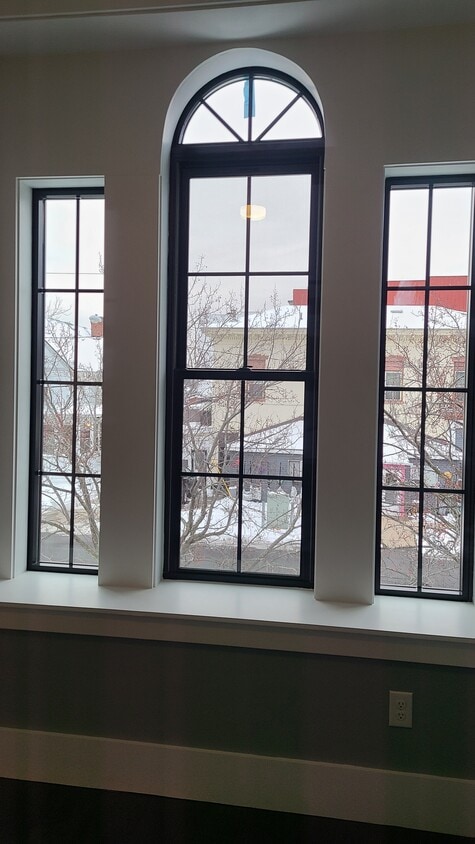 Custom made new windows in order to retain historic details. All new kitchen appliances and marble s - 77 E Bridge St