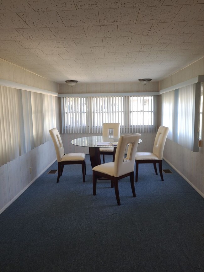 Building Photo - 55+ mobile home community. On canal to bea...