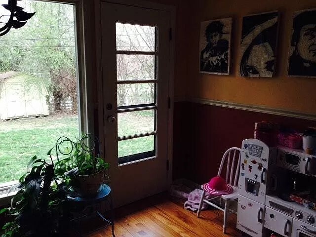 Dining area leading to the fenced backyard. - 707 S High St