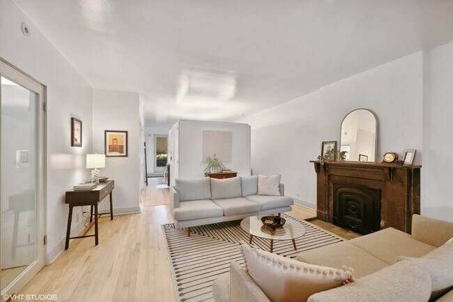 living room looking into kitchen and dining room - 2133 N Hudson Ave