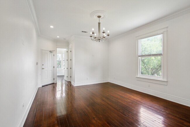 Living room with triple crown molding & recessed lighting - 1574 Jefferson Ave