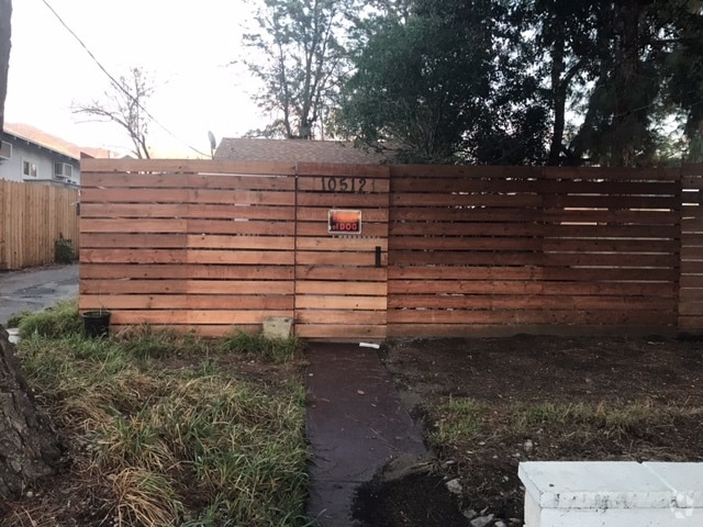 Fenced yard.  Parking in driveway - 10512 Jardine Ave
