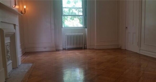 Original wooden shutters, hardwood flooring and fireplace mantle - 198 Hancock St