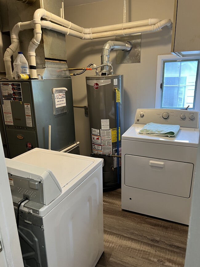 Laundry room with washer/dryer and new hot water tank and central air throughout the house - 2534 Rockefeller Rd