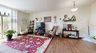 This well-appointed one-bedroom, one-bathroom residence in Brookfield, Wisconsin offers a thoughtfully designed single-floor layout that makes efficient use of its space. The living room serves as the heart of the home, featuring warm hardwood flooring, neutral walls, and a large sliding glass door that floods the area with natural light and provides access to an outdoor balcony. The open, airy atmosphere of the living room makes it feel welcoming and versatile.

The galley-style kitchen is efficiently laid out with dark cabinetry, granite countertops, stainless steel appliances including a refrigerator, range, and built-in microwave, and a double sink. Hardwood flooring continues throughout, tying the kitchen seamlessly to the main living area.

The bedroom is a comfortable and well-proportioned retreat, featuring a window with blinds and curtains that allow for natural light and privacy. Soft carpeting underfoot adds warmth to the space.

The bathroom is clean and functional, equipped with a sliding glass shower enclosure, a vanity with granite countertops, tile flooring, and ample wall space. The layout is practical and well-organized. Overall, this residence offers a cozy, complete living environment with consistent finishes throughout.