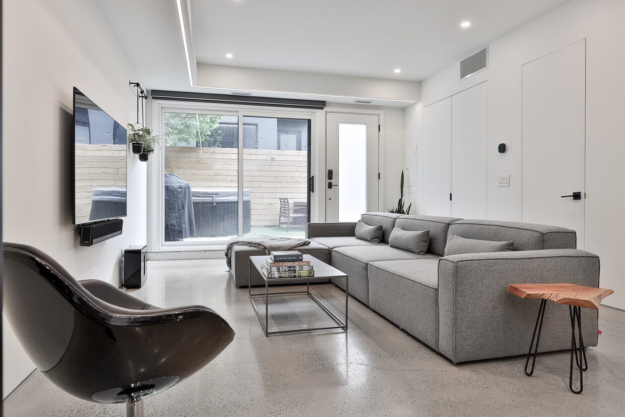 Living room overlooks the fenced rear yard - 74 Dovercourt Rd