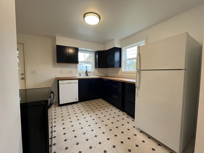 Building Photo - Charming 2-Bedroom Home with Hardwood Floors, Bright Living Spaces & Large Fenced Yard