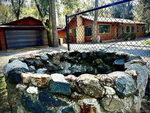 Front yard wishing well - 7627 Pine Blvd